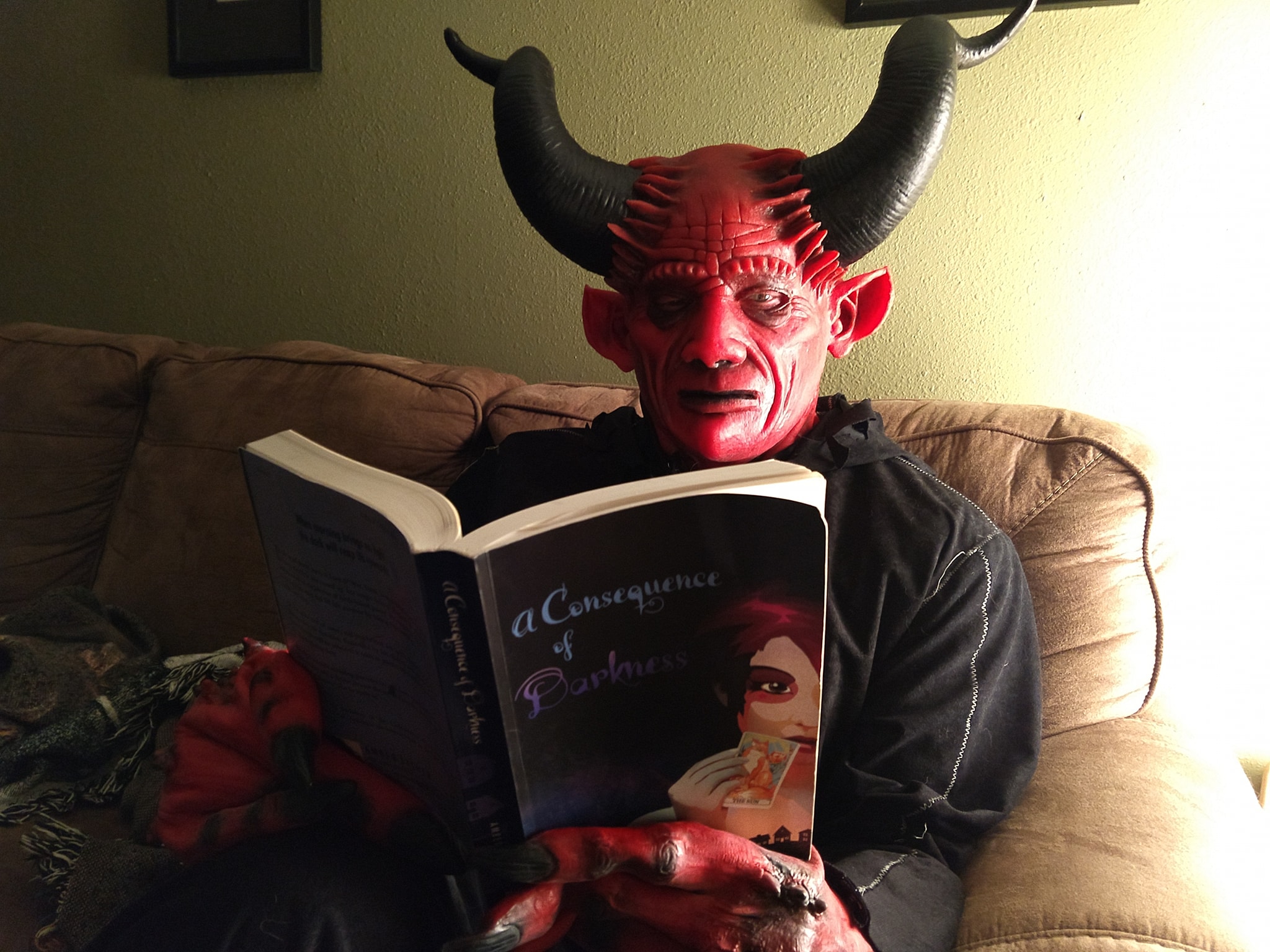 Demon reading a book